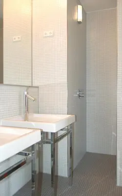 a bathroom with a sink and a shower at Villa Coucou Les Amis in Sainte-Lucie de Porto-Vecchio