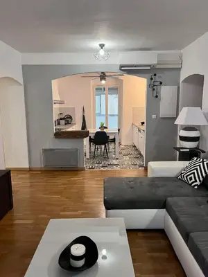 a living room with a couch and a table at Charmant Appartement centre-ville in Ajaccio