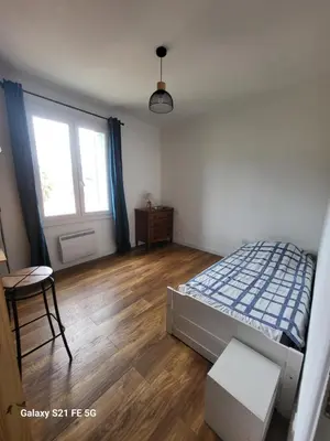 a bedroom with a bed and a window at T3 Ajaccio vue mer in Ajaccio