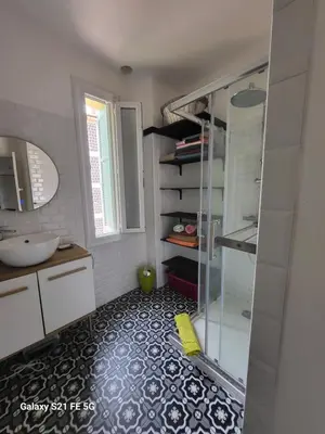 a bathroom with a glass shower and a sink at T3 Ajaccio vue mer in Ajaccio