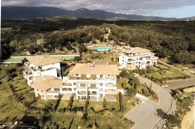 an aerial view of a large house with a pool at DOMAINE D'ARCA, T2 JARDIN PRIVE/PISCINE/TENNIS in Porto-Vecchio