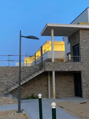 a building with a staircase on the side of it at Le Galatée Porticcio in Porticcio