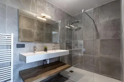 a bathroom with a sink and a shower at Villa Kalinas Corse 4 étoiles in Sari Solenzara