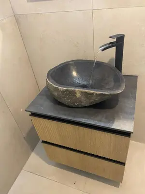 a bathroom with a sink with a faucet at Maison de charme en bord de mer in Lucciana