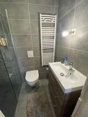 a bathroom with a toilet and a sink and a shower at La Casa San Biaggio in Ajaccio