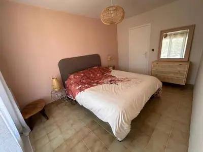 a bedroom with a large bed in a room at La Casa San Biaggio in Ajaccio