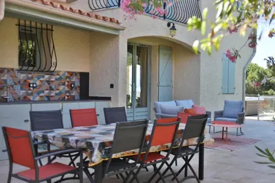 a table and chairs sitting on a patio at La Casa San Biaggio in Ajaccio