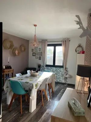 a dining room with a table and chairs at Villa Ponticchio in Santa-Lucia-di-Moriani