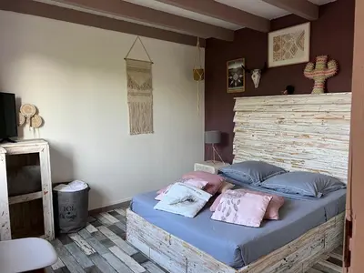 a bed with two pillows on it in a bedroom at Villa Ponticchio in Santa-Lucia-di-Moriani