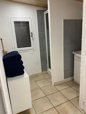 a bathroom with a toilet and a sink and a mirror at Grand chalet d’été avec piscine in Bonifacio