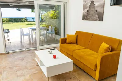 a living room with a couch and a table at A Suara Di Mare in Ghisonaccia