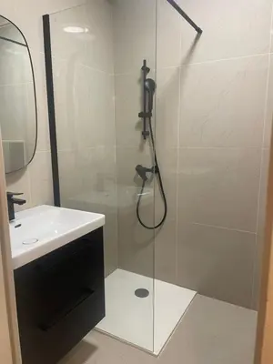 a bathroom with a shower and a sink at Charmant appartement in Ajaccio