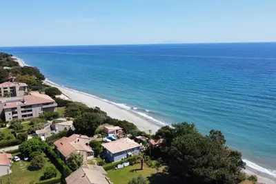 an aerial view of a house and the beach at LA VILLA DE AUDREY MER ET MONTAGNE in Santa-Lucia-di-Moriani