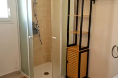 a bathroom with a shower with a glass door at Villa La Casa de Giuseppe in Cervione