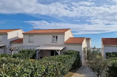 a row of houses with red tile roofs at Villa La Casa de Giuseppe in Cervione