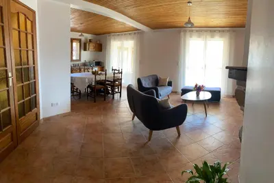 a living room with a couch and chairs and a table at Casa Orsini in Nessa