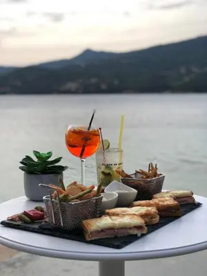 a view of a beach and the ocean at Hôtel Sampiero in Propriano