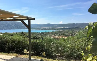 a view of a lake from a house at Residence Bellavista à Santa Giulia, proche de la plage et vue mer in Porto-Vecchio