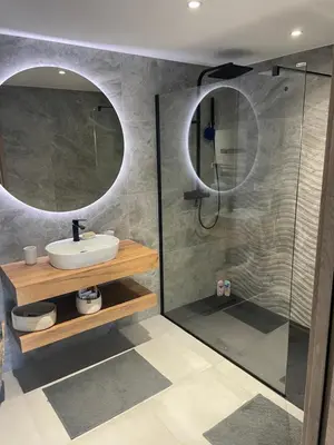 a bathroom with a sink and a shower with a mirror at Le Galatee -T2 luxe les pieds dans l'eau - Porticcio in Porticcio