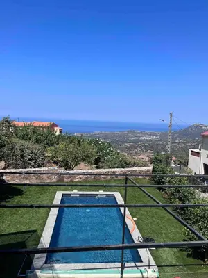 a view of a swimming pool with the ocean in the background at Corse entre mer et montagne in Lavatoggio