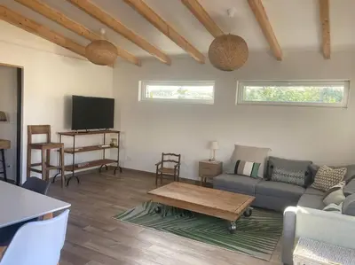 a living room with a couch and a coffee table at Petite maison avec terrasse. in Ajaccio