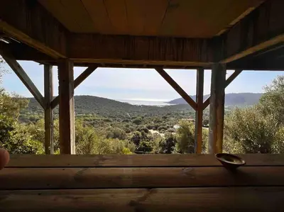 a view from the inside of a cabin with a window at Ivona Vacances - Villa de luxe avec piscine chauffée à Santa-Giulia in Porto-Vecchio
