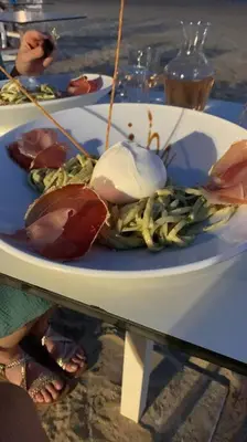 a plate of food on top of a table at Appartement duplex Porticcio avec parking in Porticcio