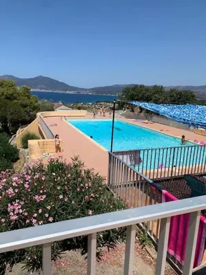 a view of a swimming pool from a balcony at Appartement duplex Porticcio avec parking in Porticcio