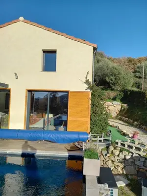 a house with a pool in front of a house at Maison neuve Vue imprenable Piscine et spa in Calenzana