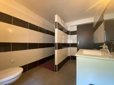 a bathroom with a toilet and a sink at Bas de villa - Canella in Sari Solenzara