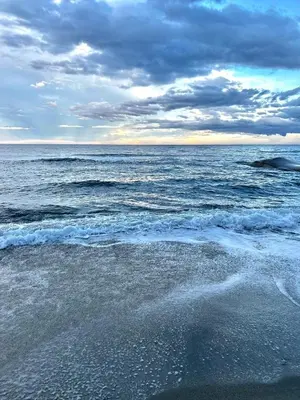 a view of the ocean on a cloudy day at Casa Virginia in Santa-Lucia-di-Moriani