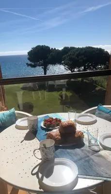 a table with a plate of food on top of it at Casa Virginia in Santa-Lucia-di-Moriani