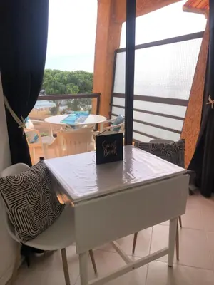 a table with a sign sitting on top of it at Casa Virginia in Santa-Lucia-di-Moriani