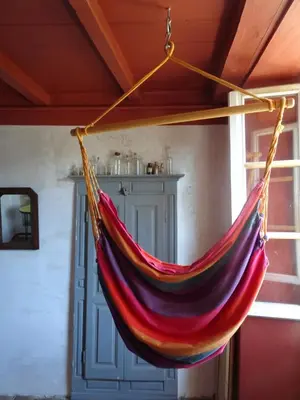 a hammock hanging from a ceiling in a room at Authentique maison de village de Gavignano in Gavignano