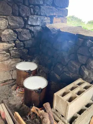 a stone room with two barrels and a stone wall at Vignarella meublé de tourisme classé 5 étoiles avec terrasse in Piana
