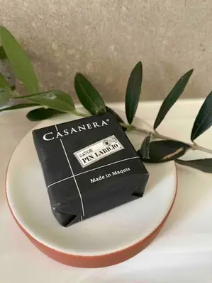a black box sitting on a plate on a table at Vignarella meublé de tourisme classé 5 étoiles avec terrasse in Piana
