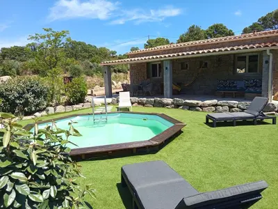 a swimming pool in a yard with a house at Bergerie U Caseddu in Pianottoli-Caldarello
