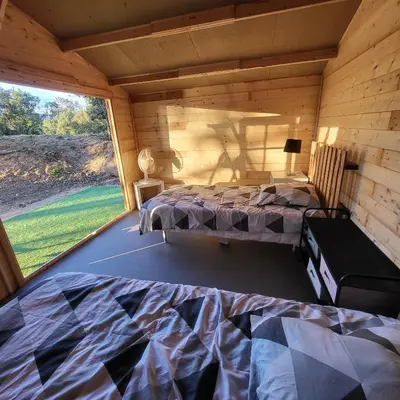 a bedroom with a bed in a room with a window at La RoseDan in Pianottoli-Caldarello