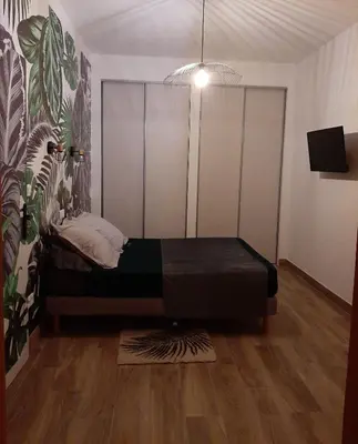 a small bedroom with a bed in a room at U Maestrale in Canale-di-Verde