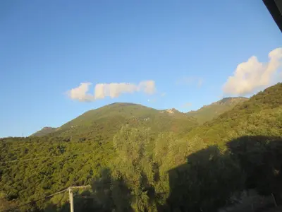 a view of a mountain range with a bridge at U Maestrale in Canale-di-Verde