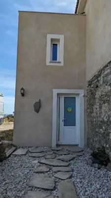 a building with a door on the side of it at U Maestrale in Canale-di-Verde