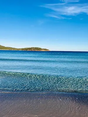 a beach with a large body of water at Hotel Les Chambres de Mila Bonifacio in Bonifacio