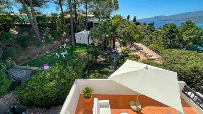 an overhead view of a patio with an umbrella at A'mare Corsica I Seaside Small Resort in Propriano