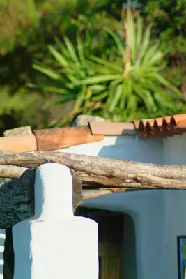 a pile of wood on the top of a fence at A'mare Corsica I Seaside Small Resort in Propriano