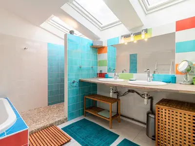 a bathroom with two sinks and a shower at Villa Villa Romana by Interhome in Porto-Vecchio