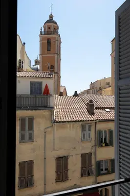 a view of a building with a clock tower at Les Appartements du Roi de Rome - Hypercentre Ajaccio in Ajaccio