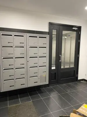a row of lockers in a room with a door at Superbe T2 neuf Bonifacio avec parking gratuit in Bonifacio