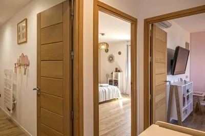 a room with a door leading to a bedroom at Villa Les 2 F plage de Losari - Belgodère in Belgodère