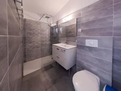 a bathroom with a toilet and a sink at Holiday Home Dentice by Interhome in Sari Solenzara