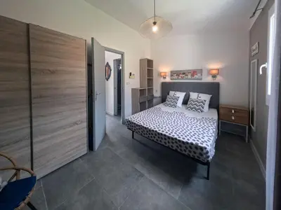 a bedroom with a bed with pillows on it at Holiday Home Ciriola by Interhome in Sari Solenzara